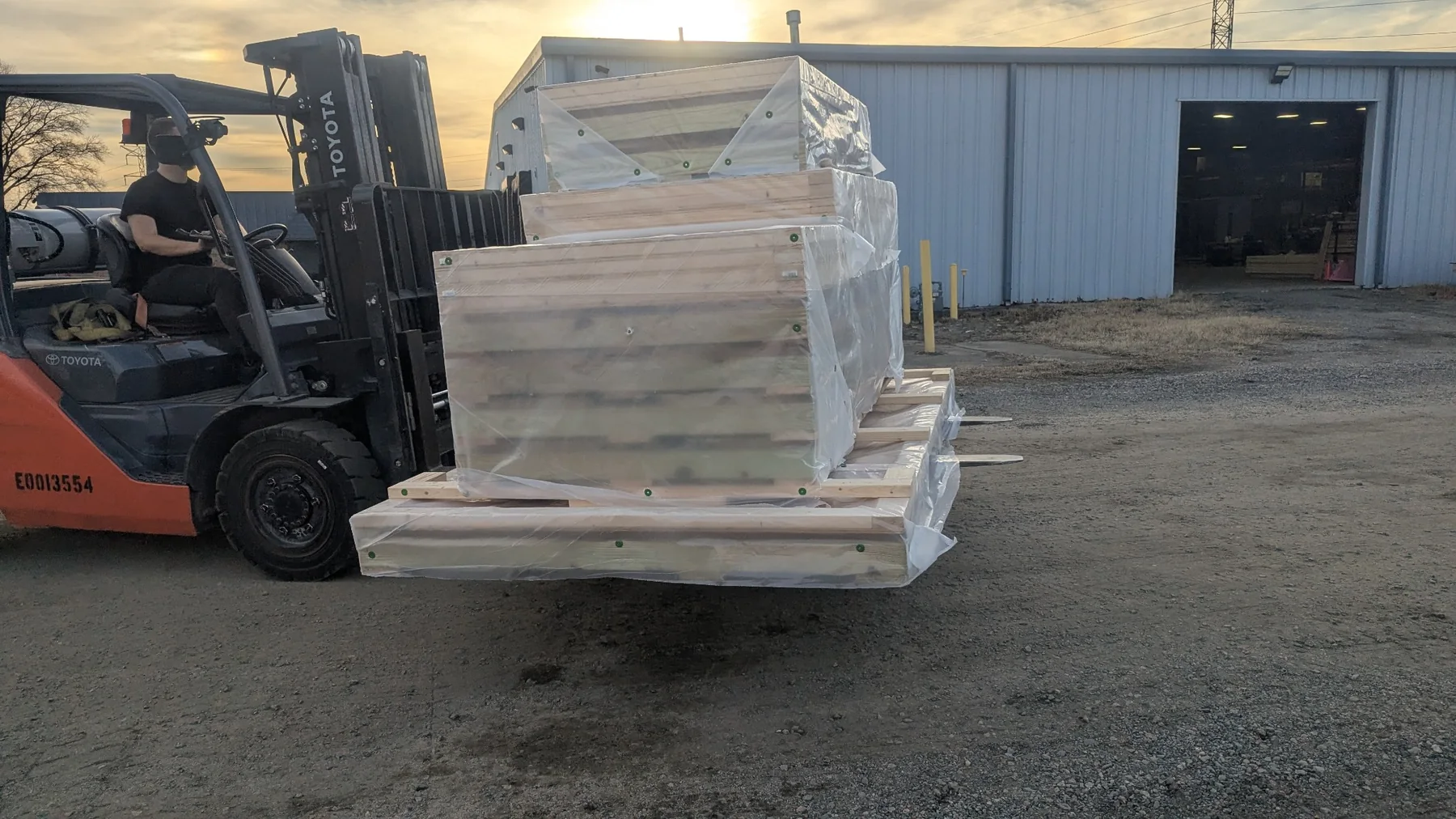 Flat-pack shipping crate assemblies staged for delivery