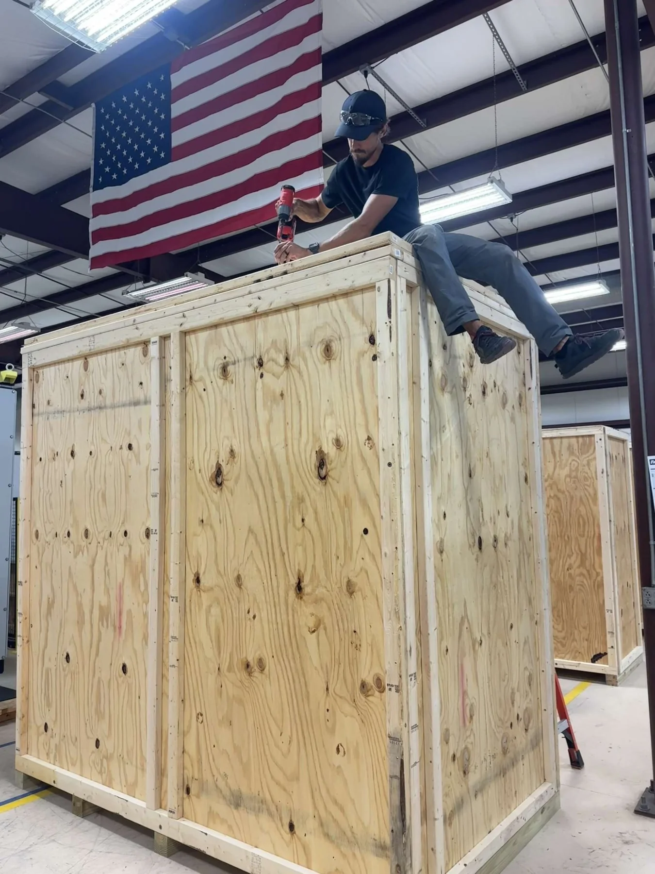 Flat-pack shipping crate sections prepared for delivery